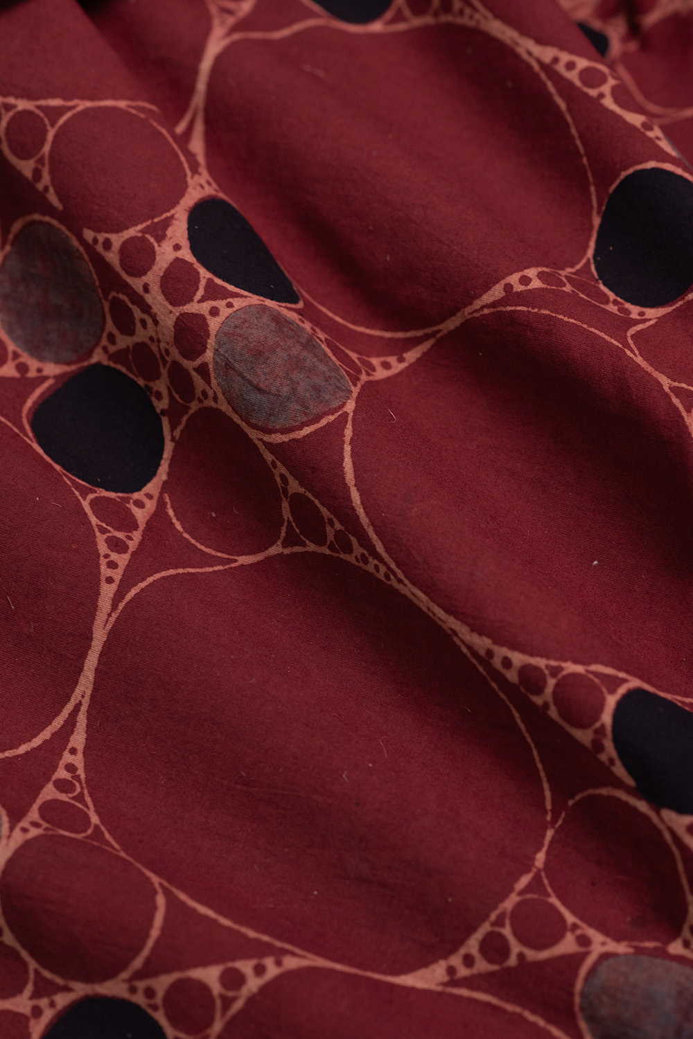 Irregular Circles on Maroon Ajrak Cotton Fabric - Image 3