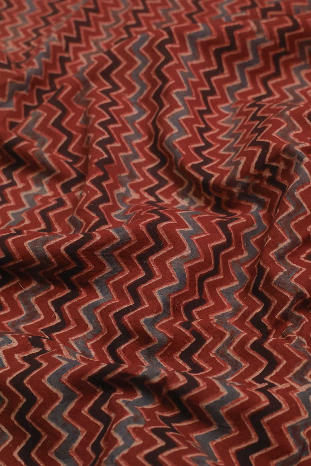 Zig Zag Patterns on Maroon Ajrak Cotton Fabric - Image 2
