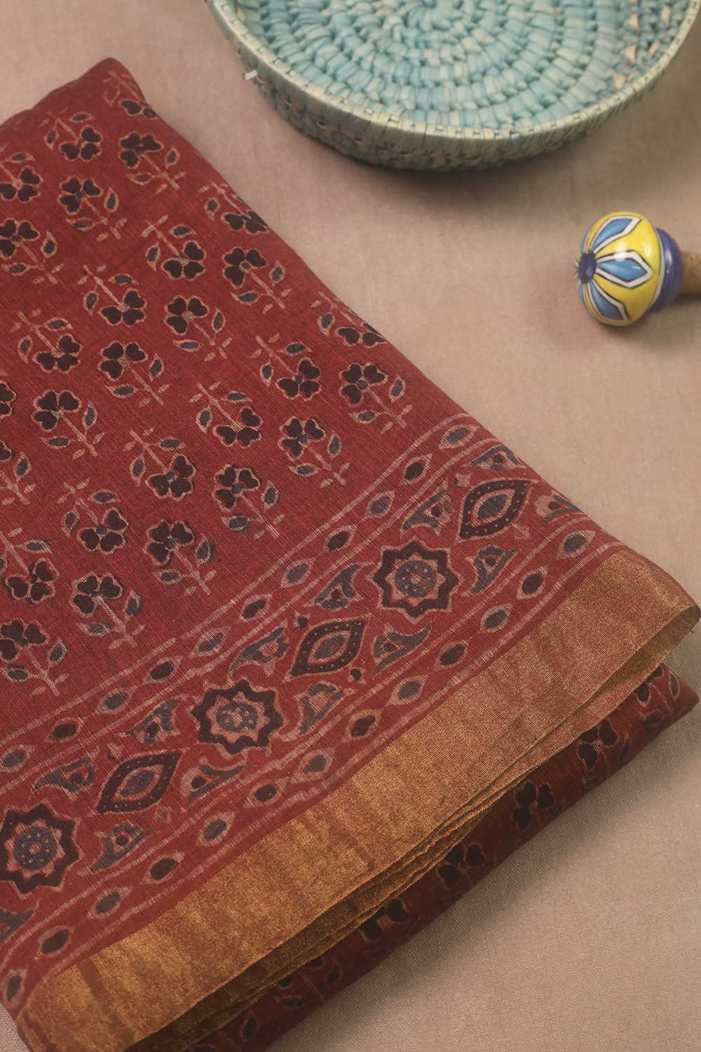 Motifs on Maroon Ajrak Linen saree