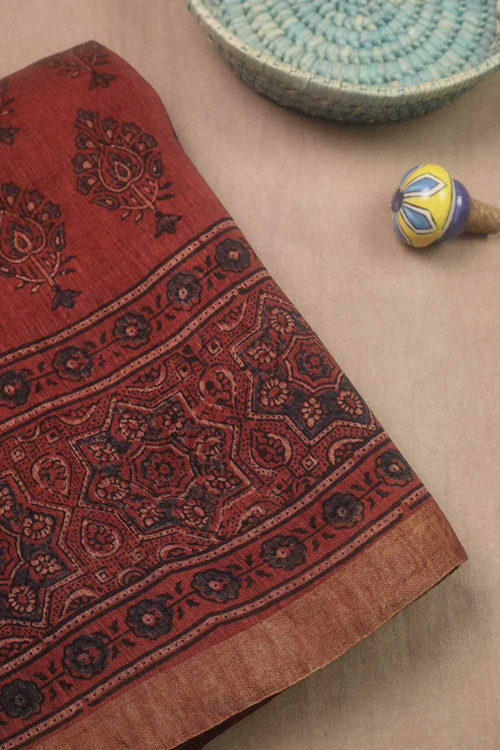 Motifs on Maroon Ajrak Linen saree