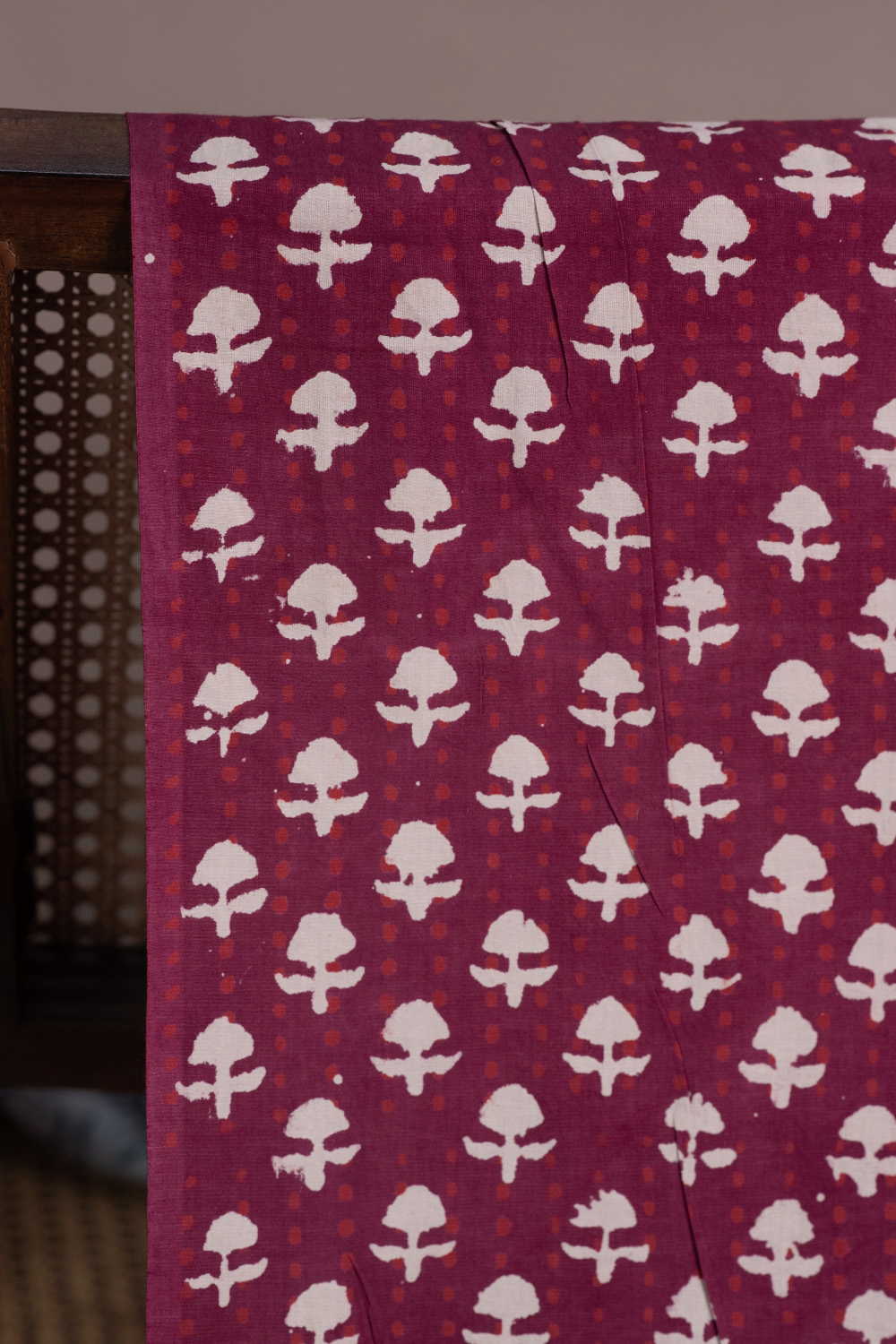 Cream Butta on Maroon Dabu Cotton Fabric