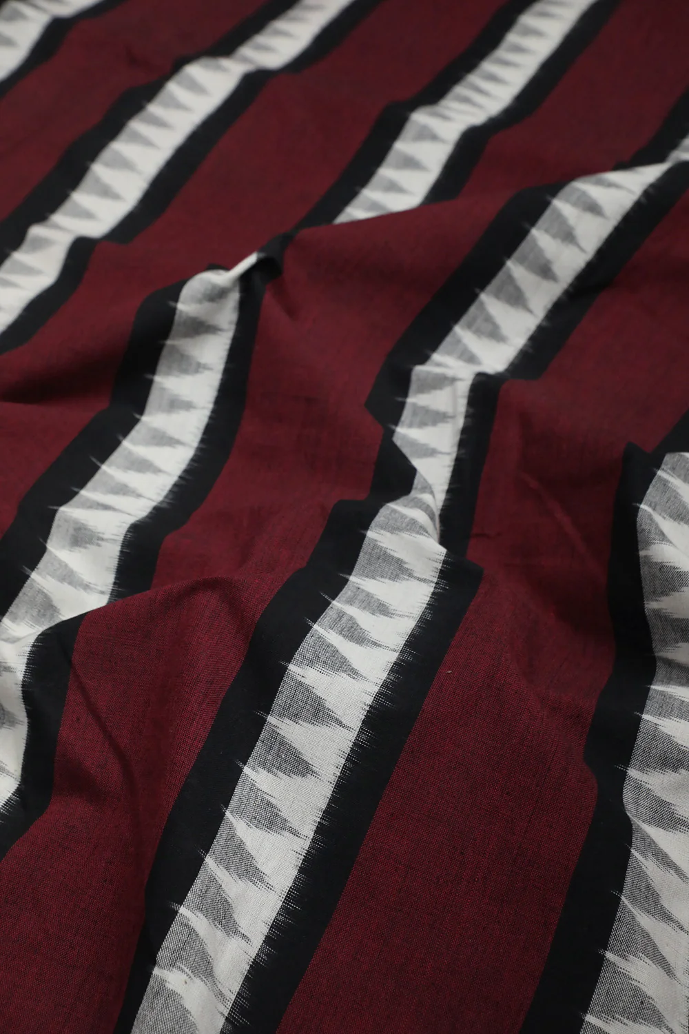 Patterns on Maroon Patterned Ikat cotton Fabric - Image 2