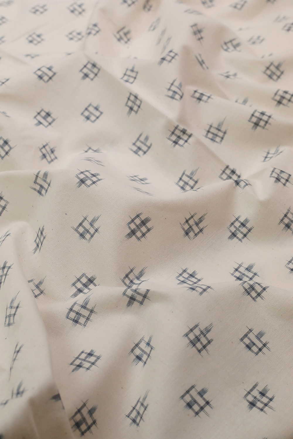 Blue Motifs on Cream Ikat Cotton Fabric - Image 3