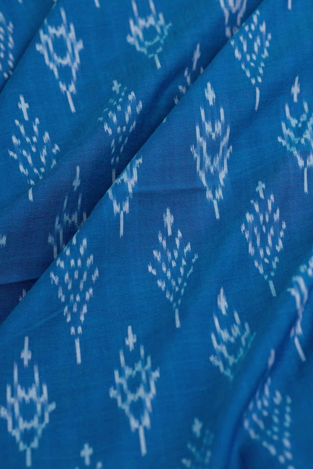 Cream Motifs on Blue Mercerized Ikat Cotton Fabric - Image 3
